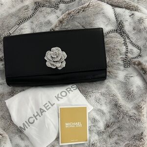Michael Kors Silver Chain Shoulder Bag with Crystal Flower Accent.